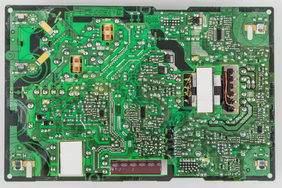 The solder side of a flat-panel TV power supply board, removed from the set
